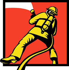 Image showing Firefighter or fireman aiming a fire hose 