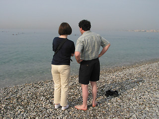Image showing Couple at the beach of Nice, France an early, misty morning.
