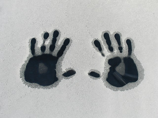 Image showing Warm hands on a cold car some frosty winter morning.