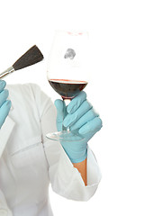 Image showing Forensic scientist dusting glass fingerprints