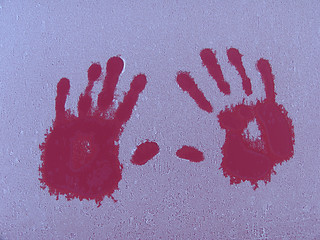 Image showing Warm hands on a cold car some frosty winter morning.