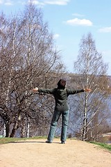 Image showing The girl is pleased to spring, sunshine, warmth, the nature