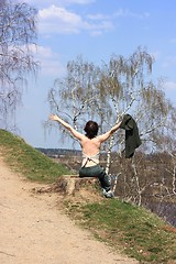 Image showing The girl is pleased to spring, sunshine, warmth, the nature