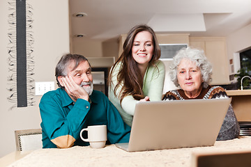 Image showing Teenage girl with grandparents using laptop