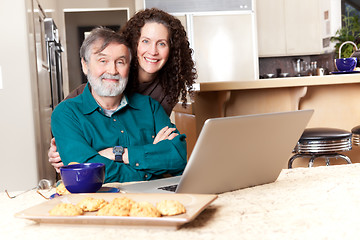 Image showing Father and daughter using laptop