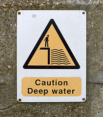 Image showing caution deep water sign on wall