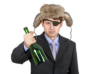 Image showing Russian business man in hat earflaps, offers to drink alcohol