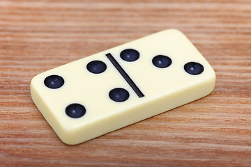 Image showing Dominoes on wooden surface close up