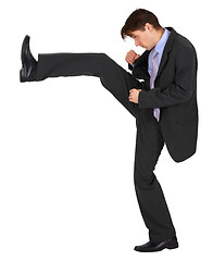 Image showing Businessman kicks up on white background