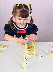 Image showing Child plays with toys at table