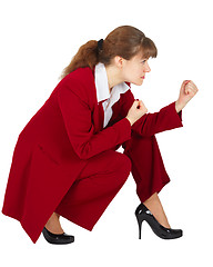 Image showing Business woman sitting in combat readiness