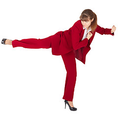 Image showing Young girl kicks back on white background