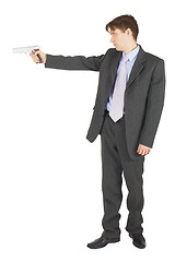 Image showing Businessman aiming a gun