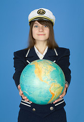 Image showing Girl in sea uniform with globe