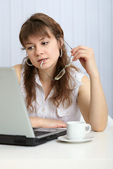 Image showing Young woman thought working with computer
