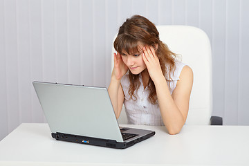 Image showing A student preparing for exam with a laptop