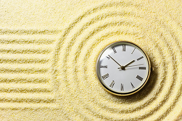 Image showing Composition on Zen garden - sand, and watch