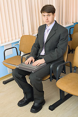 Image showing Person in a suit with the laptop