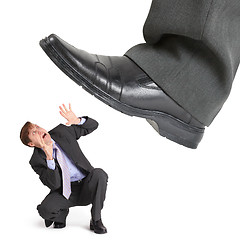 Image showing Big foot of crisis crushes small entrepreneur