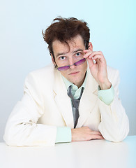Image showing Funny disheveled young man in glasses