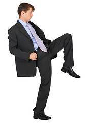 Image showing Businessman knee kick on white background 