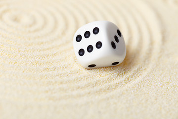 Image showing Abstract composition in sand with white dice - Zen Garden