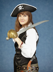 Image showing Beautiful woman in clothes of pirate on blue background