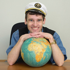 Image showing Young smiling guy in cap