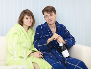 Image showing Young happy couple drinks sparkling wine