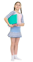 Image showing Ûchoolgirl has large armful of books