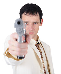 Image showing Businessman aiming a gun on white background