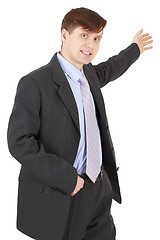 Image showing Young man in business suit shows his hand