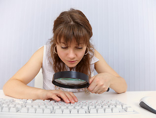 Image showing Woman with poor eyesight to work with keyboard