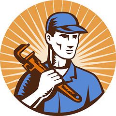 Image showing Plumber hand holding monkey wrench