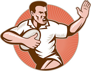 Image showing rugby player running with ball fending off