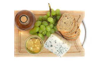 Image showing wine, grapes, cheese and bread on the white background