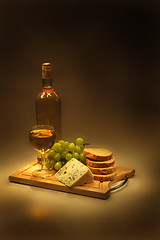 Image showing wine, grapes, cheese and bread in the night