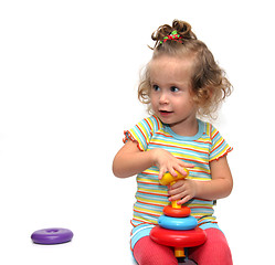 Image showing cute little girl playing with pyramid