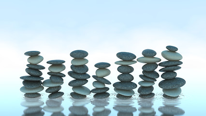 Image showing Seven Pebble stacks on water