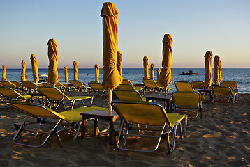 Image showing Yellow Sunshades And Sunbeds