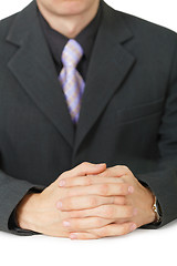 Image showing Hands of businessman lying on table