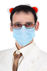 Image showing Man in a medical mask and with pig ears