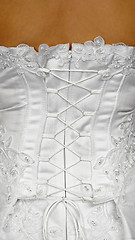 Image showing Corset of white wedding dress - rear view