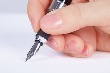 Image showing Person signs documents - hand close up