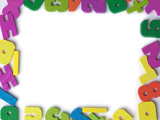 Image showing Blank frame of colored wooden toy figures