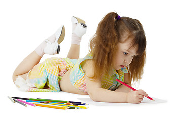 Image showing Little girl on floor drawing with crayons