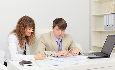 Image showing Two young worker at workplace