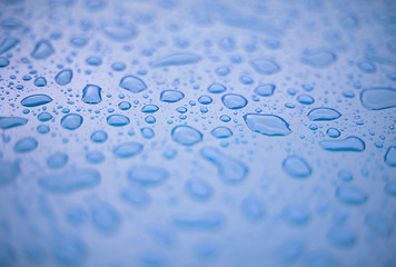 Image showing Abstract background - water drops on blue plastic