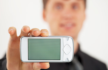 Image showing Man shows LCD screen mobile phone