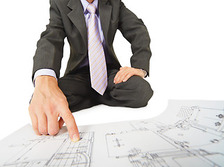 Image showing Engineer works with drawings, close-up without face